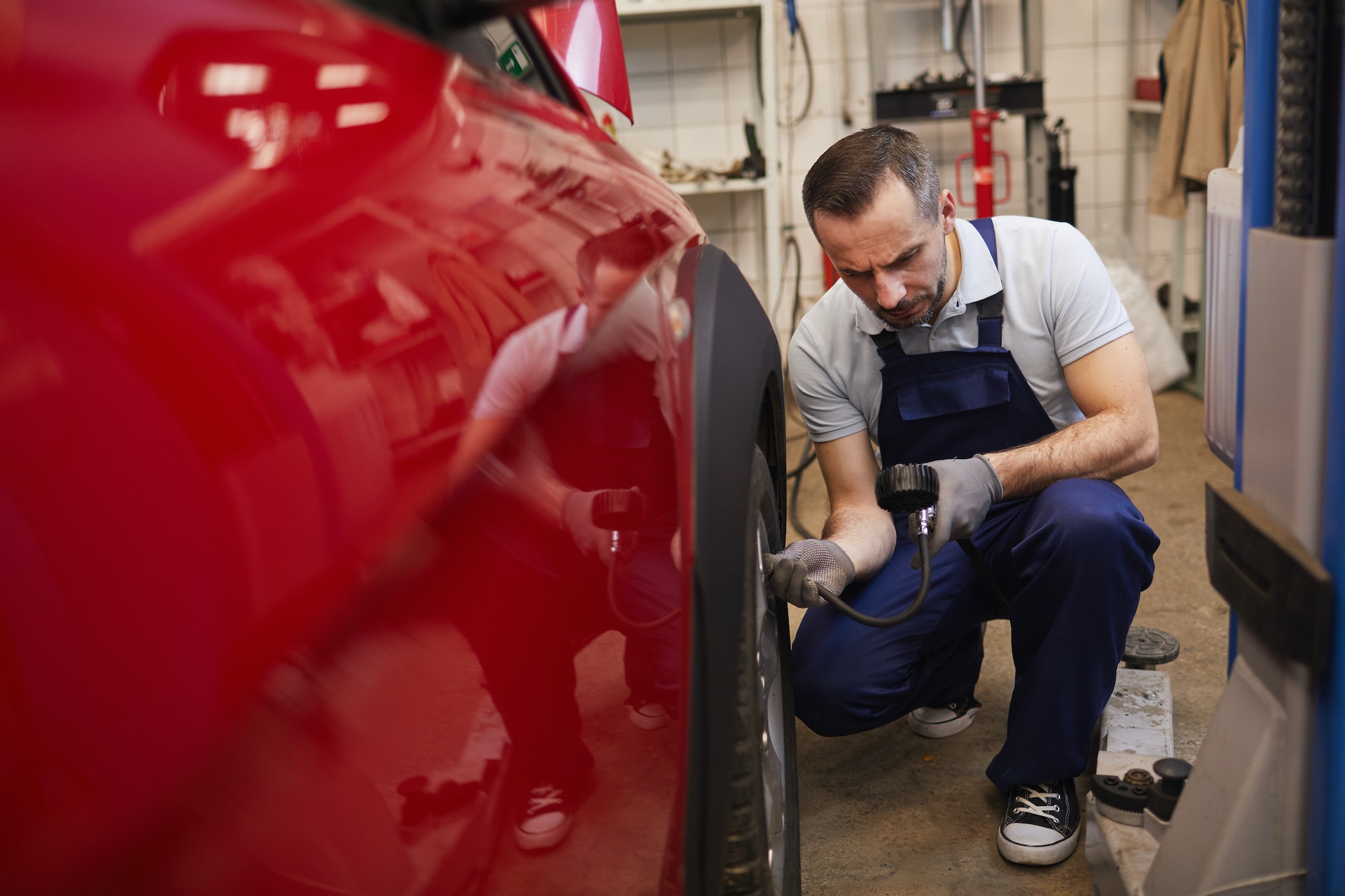 Mechanic Checking Car Tires